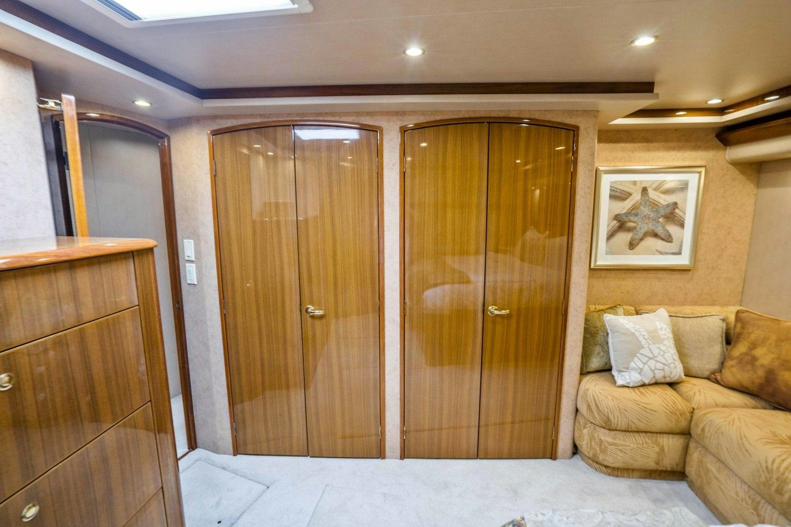 a room with a couch and a door aboard TRANQUILO Yacht for Sale