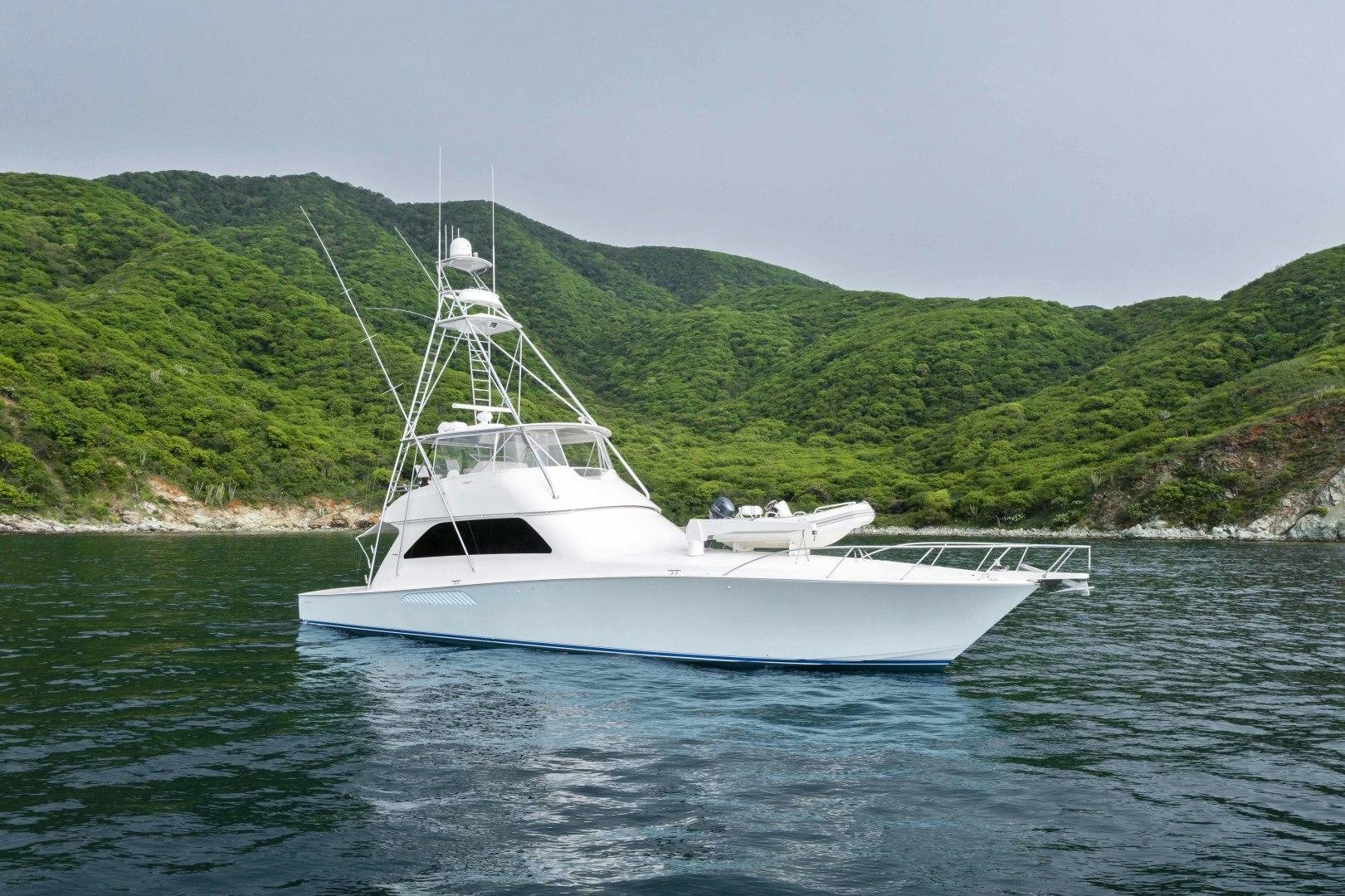 a white boat in the water aboard TRANQUILO Yacht for Sale