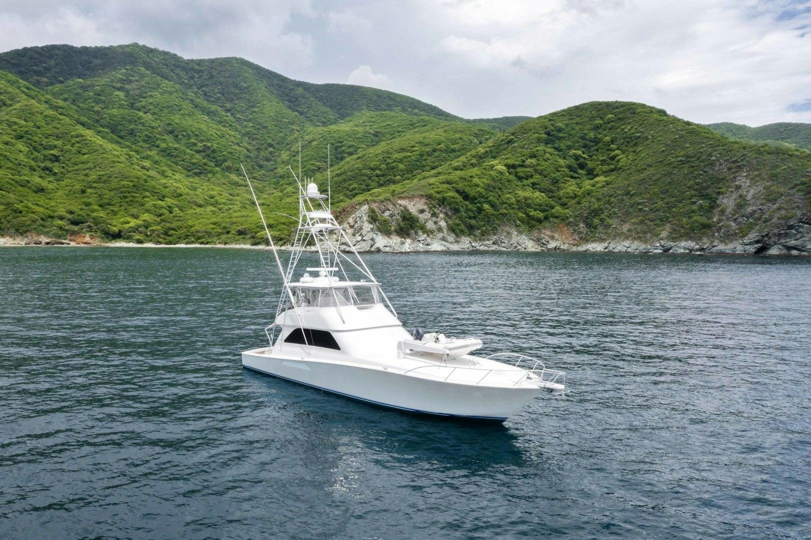 a white boat on the water aboard TRANQUILO Yacht for Sale