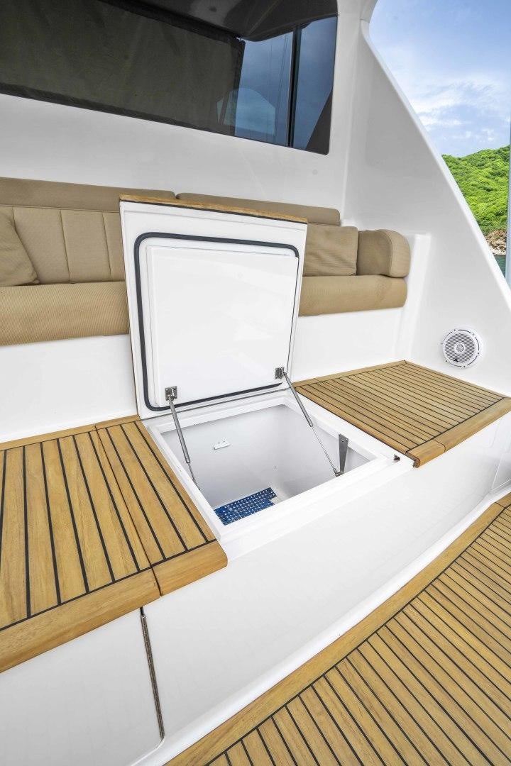 a white rectangular object with a wooden frame on a white surface aboard TRANQUILO Yacht for Sale