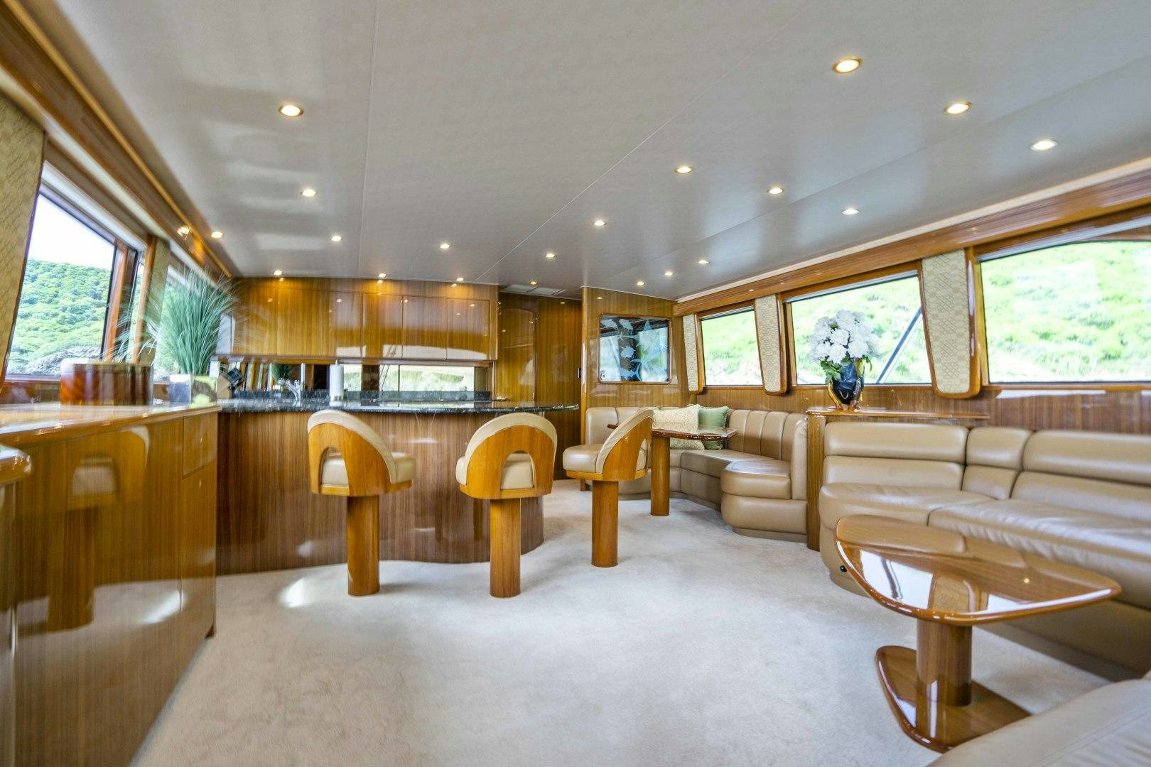 a large room with a couch and a table aboard TRANQUILO Yacht for Sale