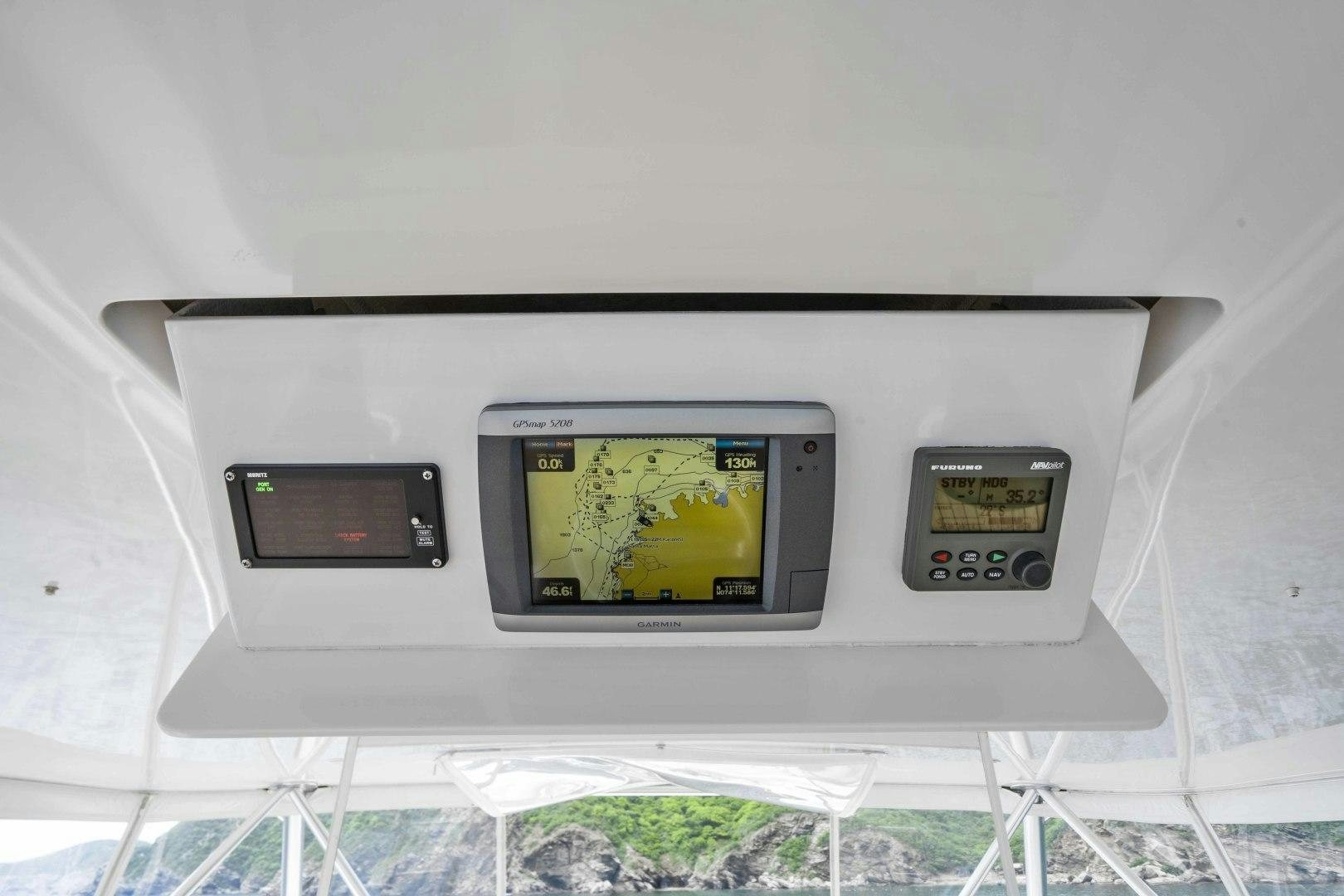 a white machine with a screen aboard TRANQUILO Yacht for Sale