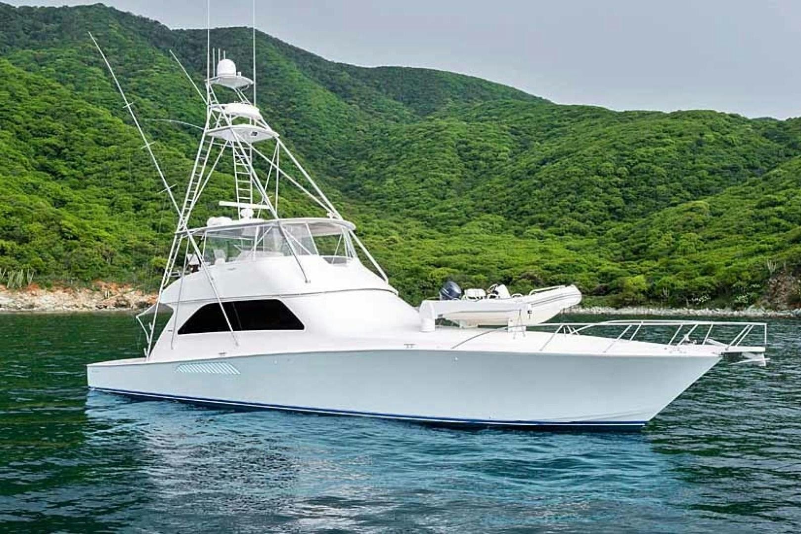 a white boat in the water aboard TRANQUILO Yacht for Sale
