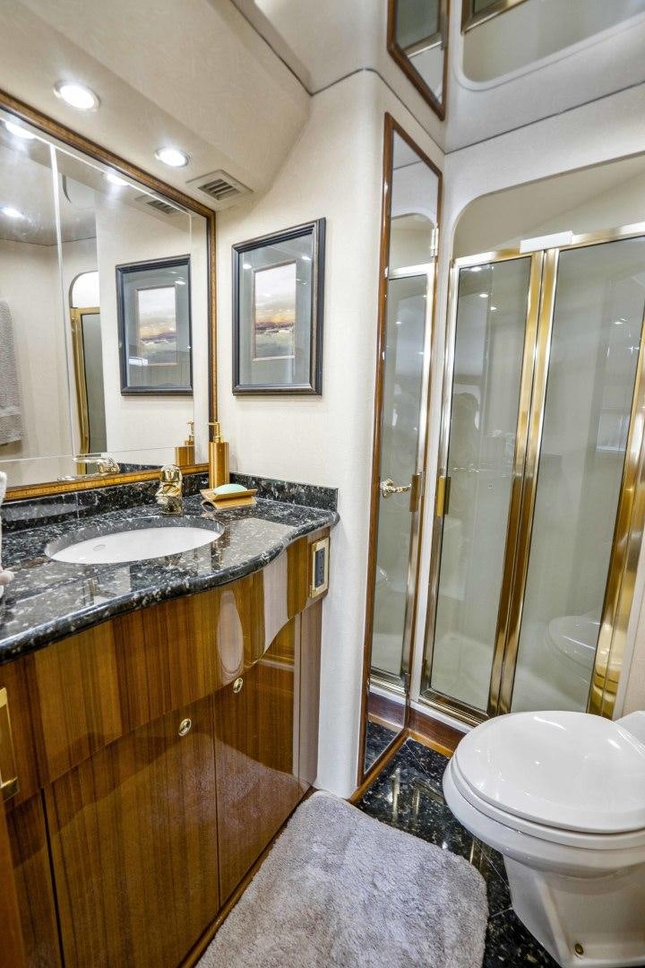 a bathroom with a glass shower aboard TRANQUILO Yacht for Sale