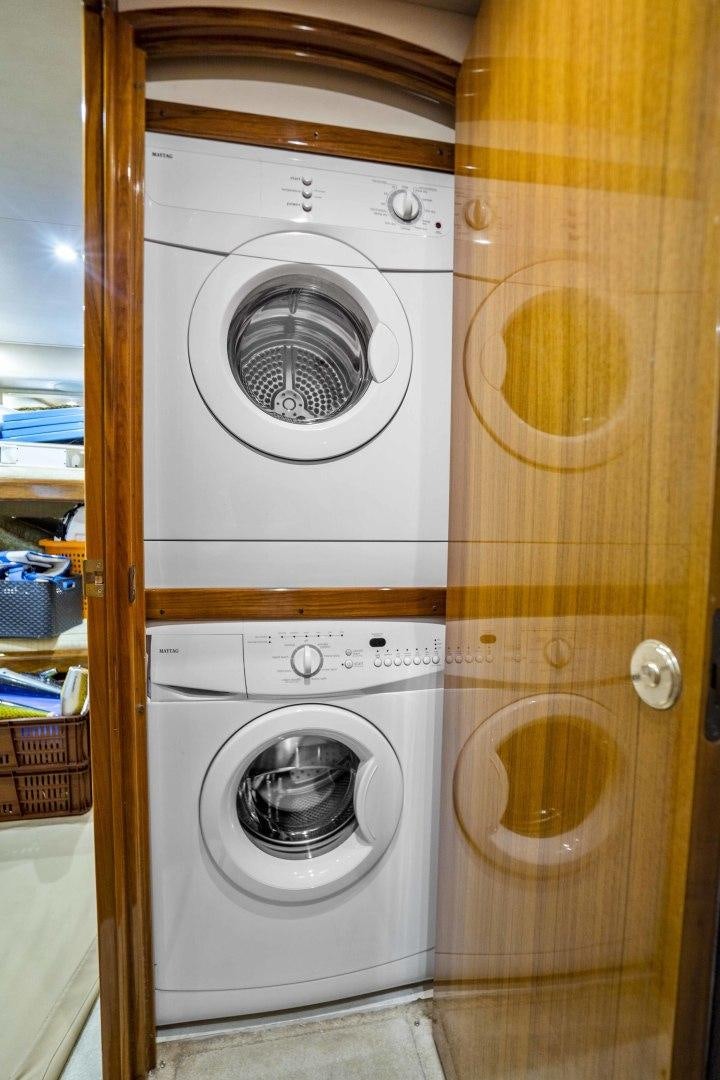 a washer and dryer in a room aboard TRANQUILO Yacht for Sale