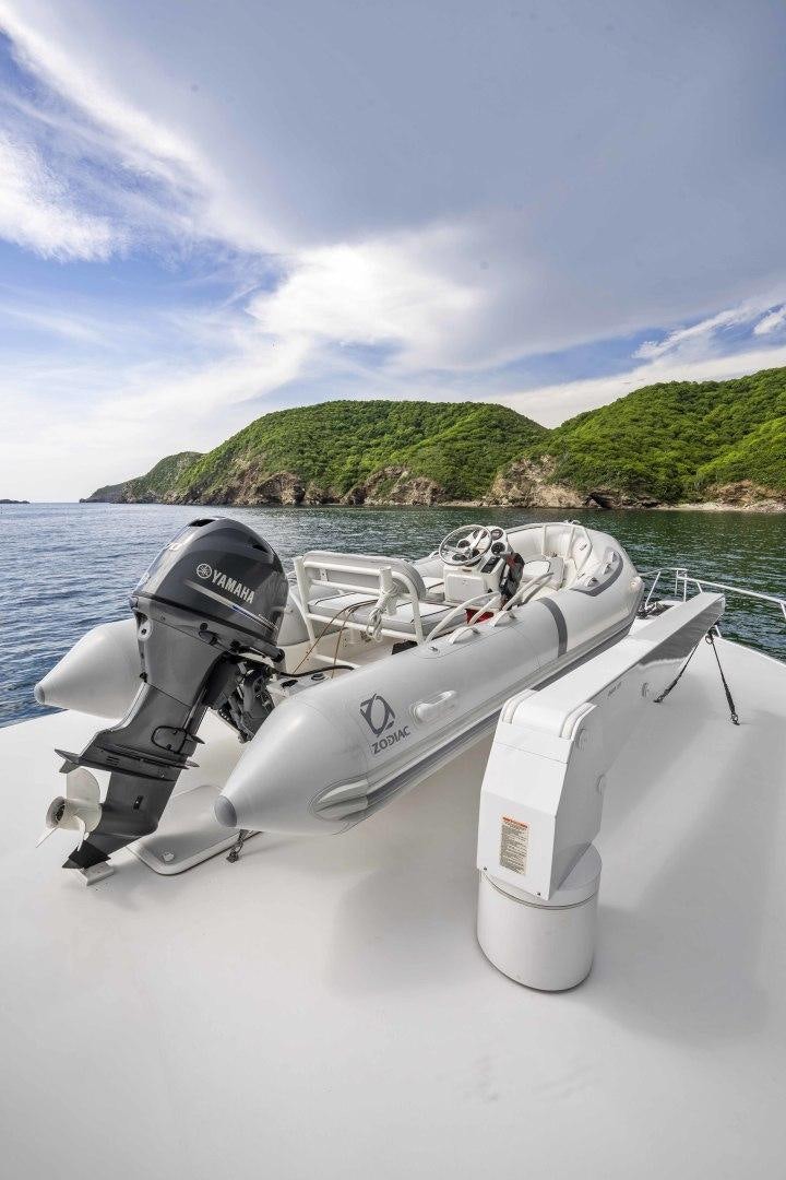 a boat with a motor attached to it aboard TRANQUILO Yacht for Sale
