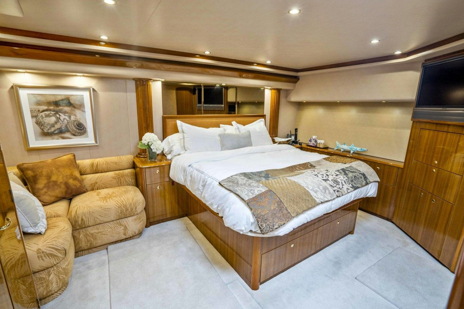 a bed and a couch in a room aboard TRANQUILO Yacht for Sale