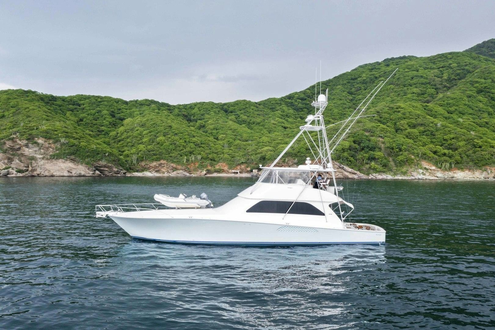 a white boat on the water aboard TRANQUILO Yacht for Sale