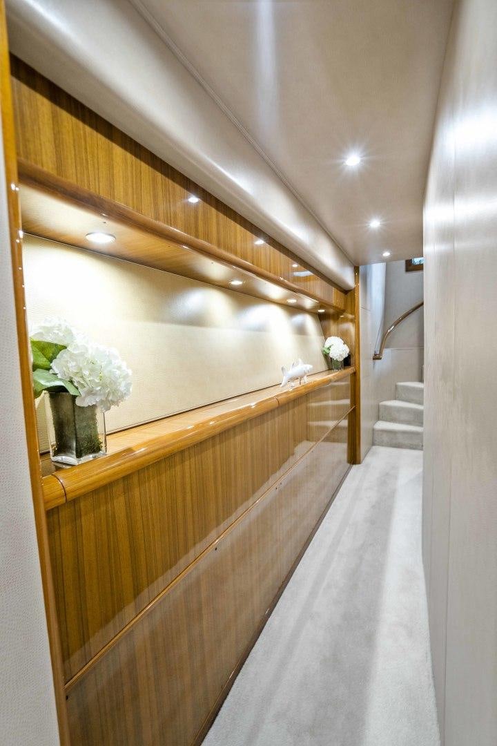a long hallway with white walls aboard TRANQUILO Yacht for Sale