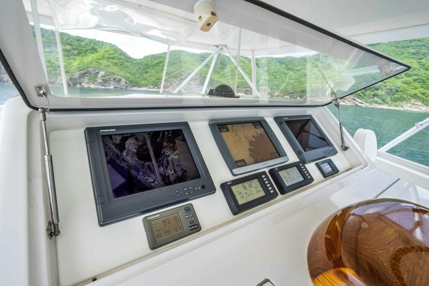 a person sitting in a car aboard TRANQUILO Yacht for Sale