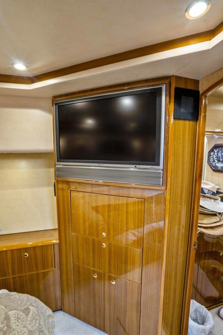 a tv on a cabinet aboard TRANQUILO Yacht for Sale