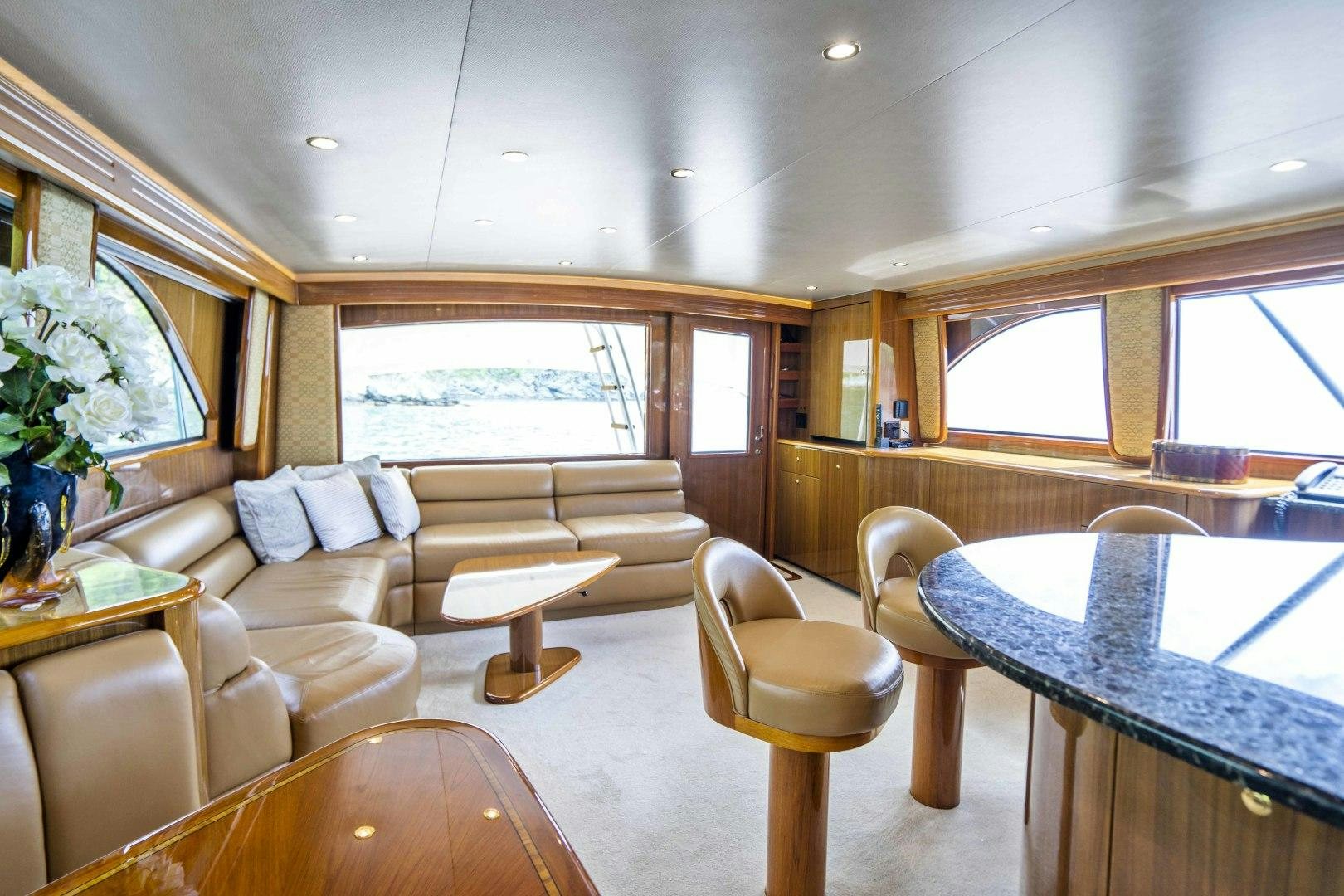 a living room with a large window aboard TRANQUILO Yacht for Sale