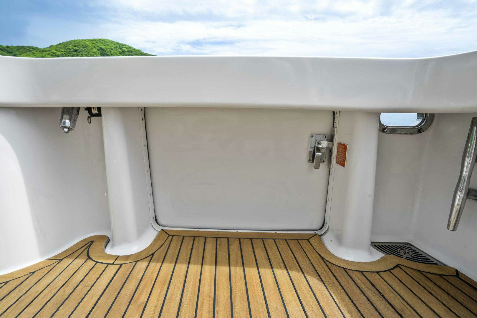 a white car with a red tag aboard TRANQUILO Yacht for Sale