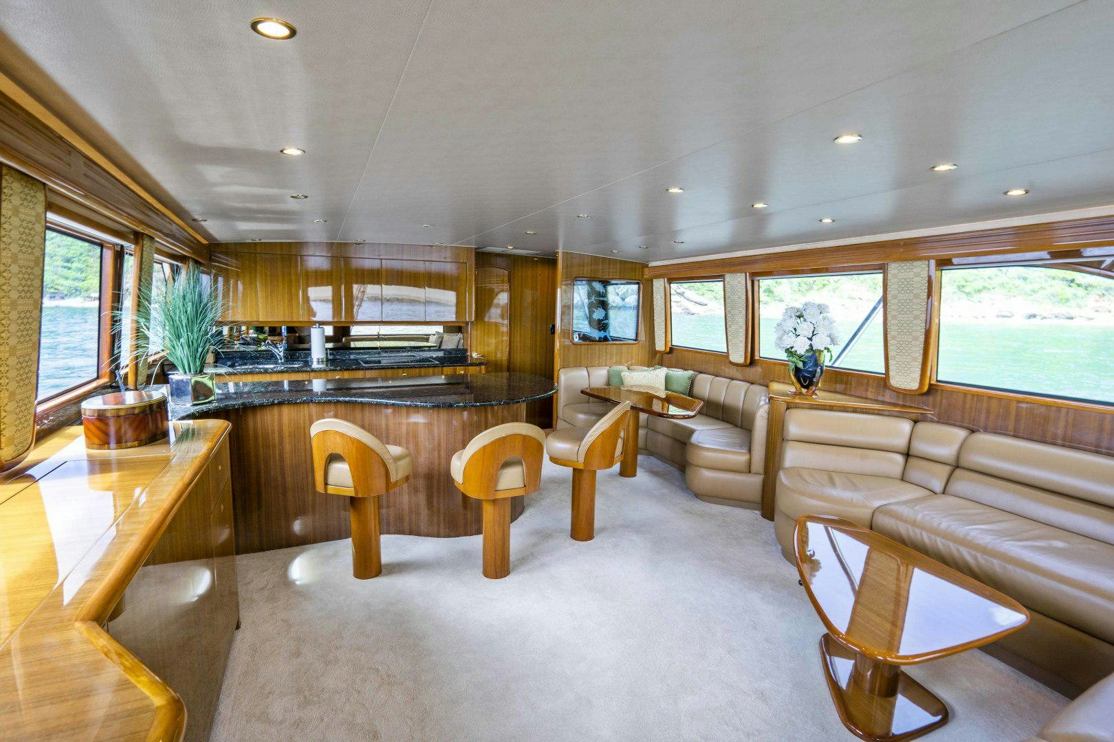 a large living room with a large window aboard TRANQUILO Yacht for Sale