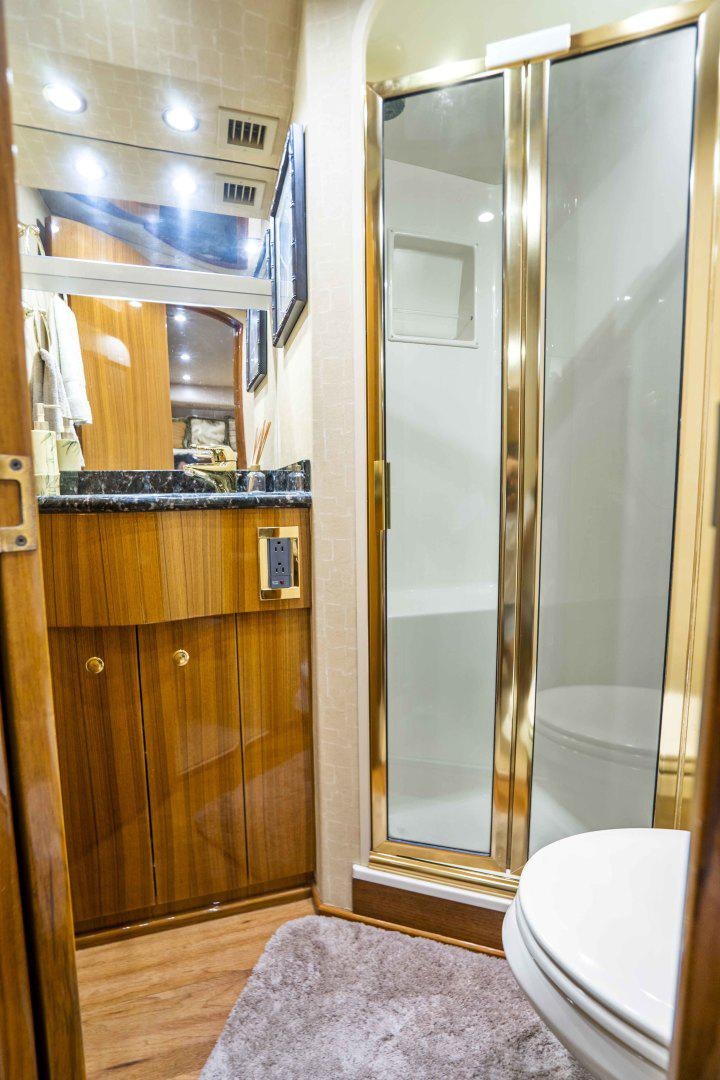 a bathroom with a glass shower aboard TRANQUILO Yacht for Sale
