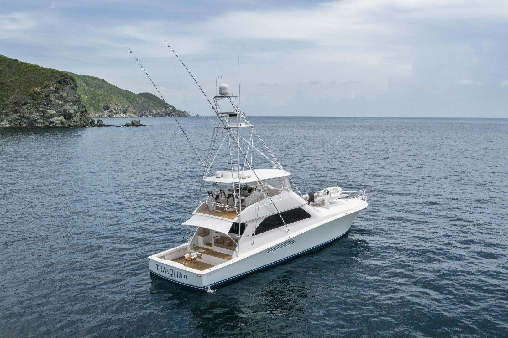 a white boat in the water aboard TRANQUILO Yacht for Sale