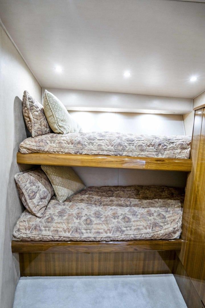 a bed with a pillow aboard TRANQUILO Yacht for Sale