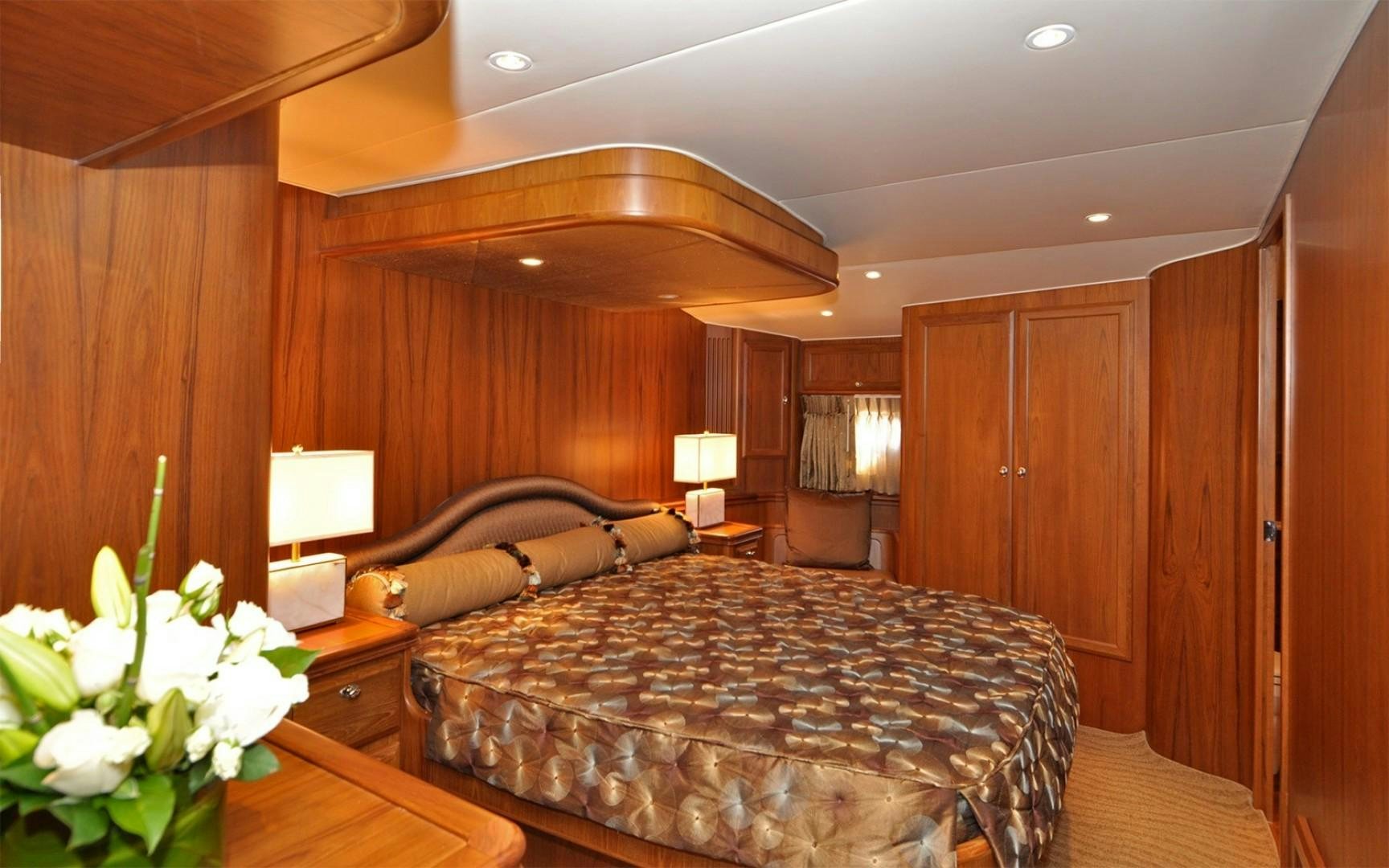 a bedroom with a bed and a desk aboard ONE MORE DAY Yacht for Sale