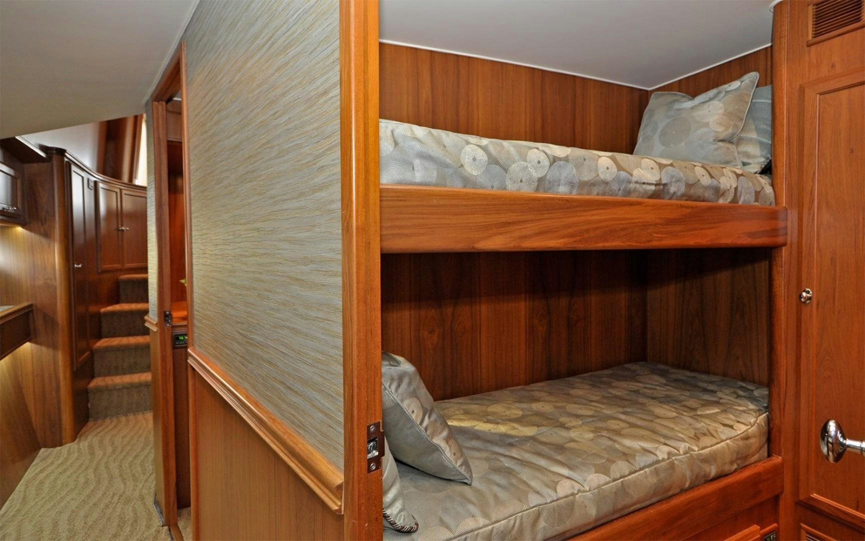 a bed with a wooden frame aboard ONE MORE DAY Yacht for Sale
