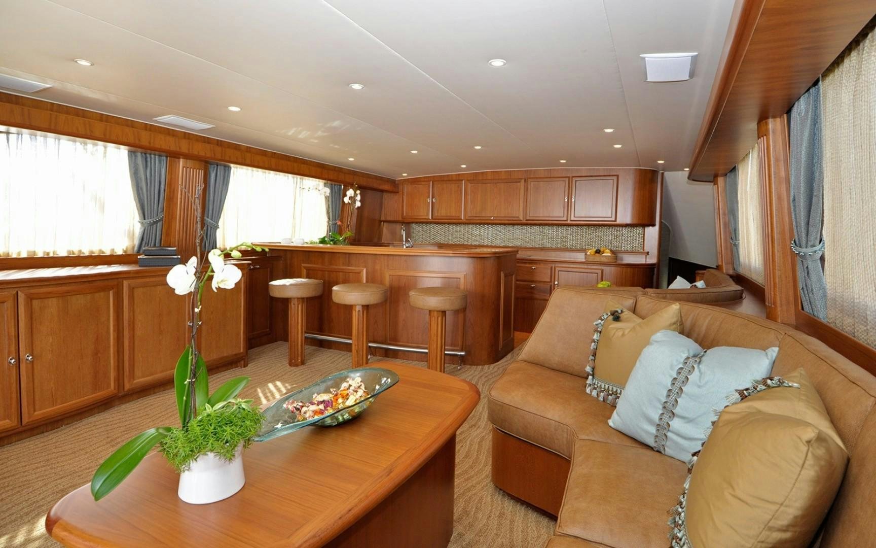 a living room with a couch and a coffee table aboard ONE MORE DAY Yacht for Sale