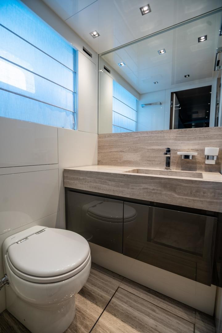 a bathroom with a large mirror aboard ACE Yacht for Sale