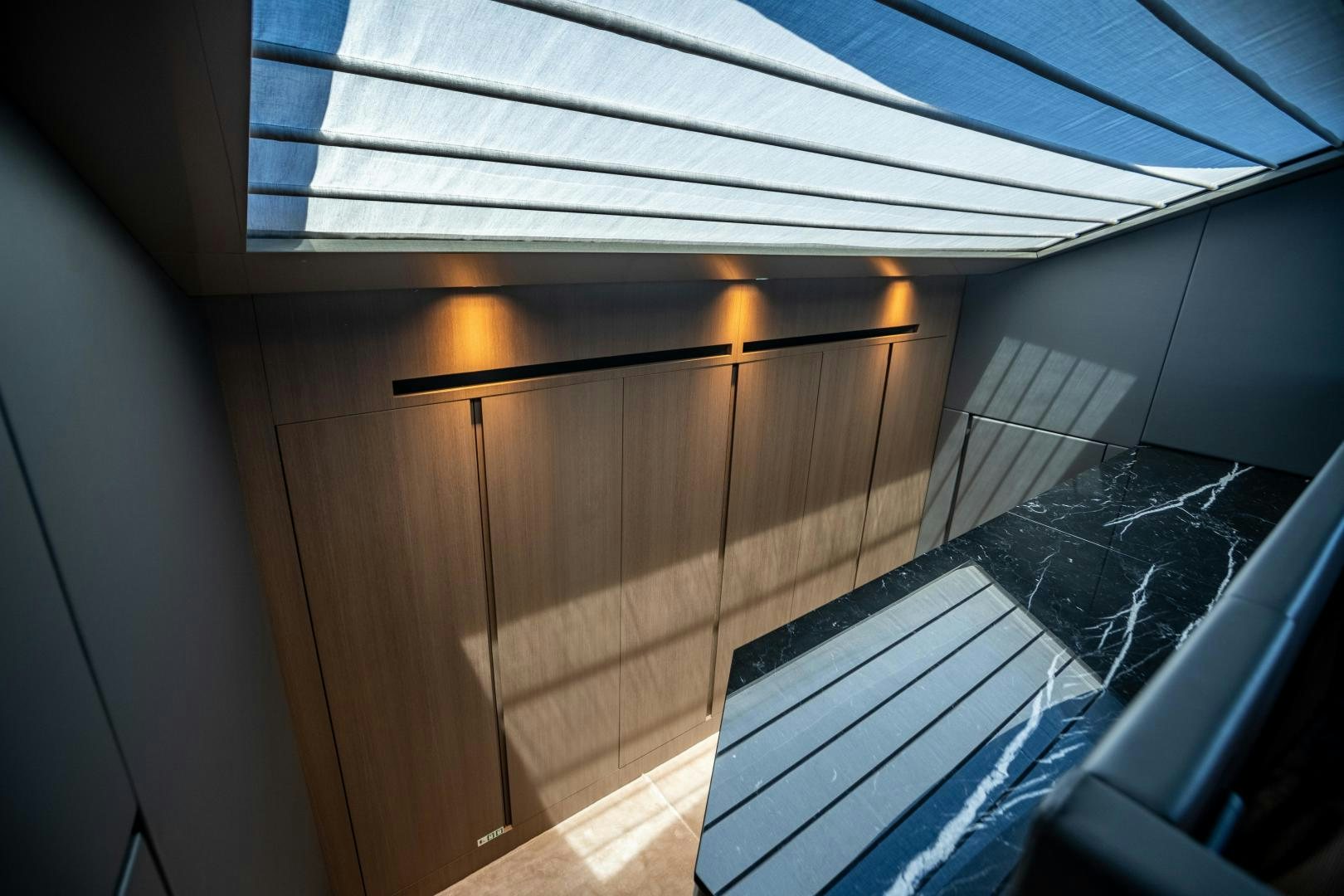 a room with a glass ceiling and a wood door aboard ACE Yacht for Sale