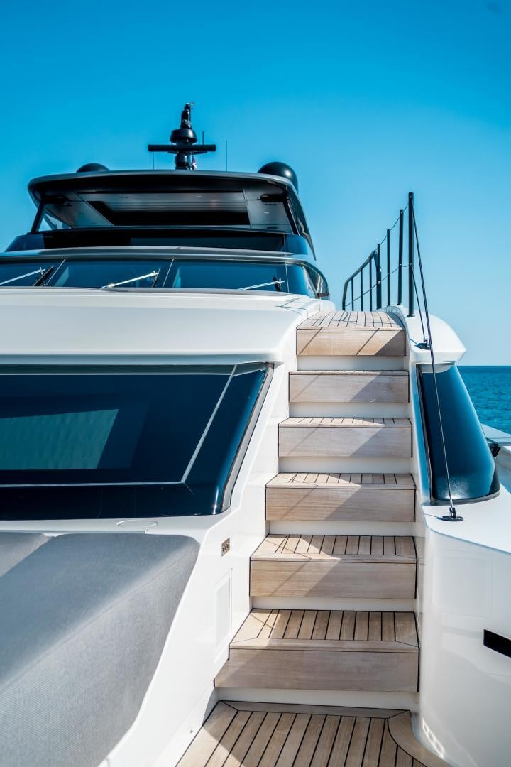 a white car with a black hood aboard ACE Yacht for Sale