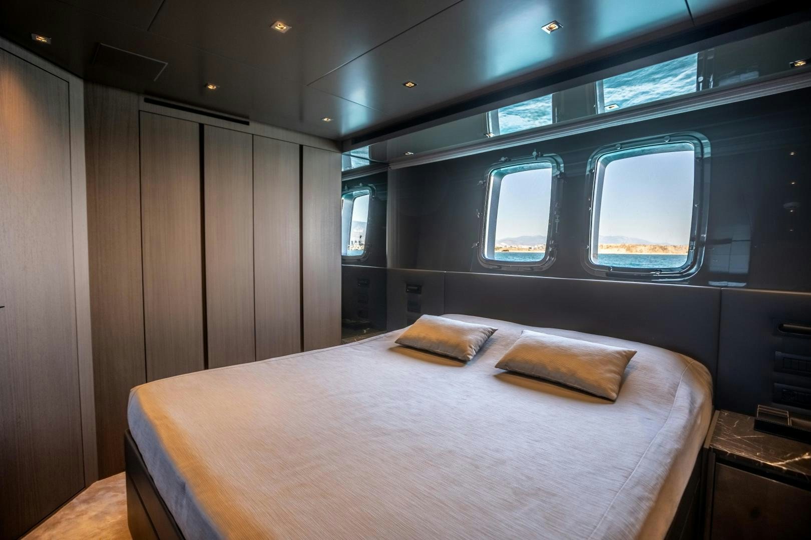 a bed in a room aboard ACE Yacht for Sale