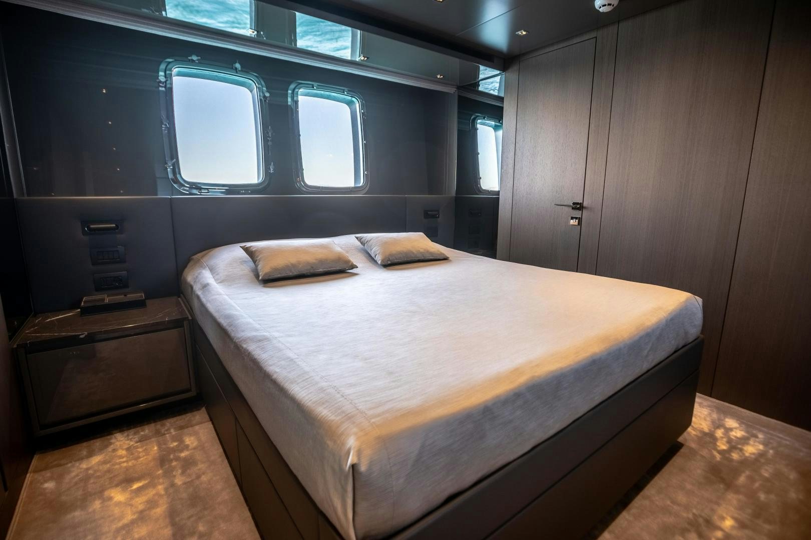 a bed in a room aboard ACE Yacht for Sale