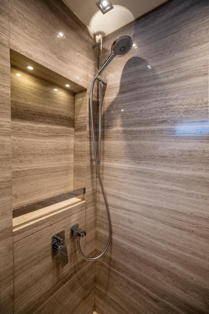 a shower head with a glass door aboard ACE Yacht for Sale