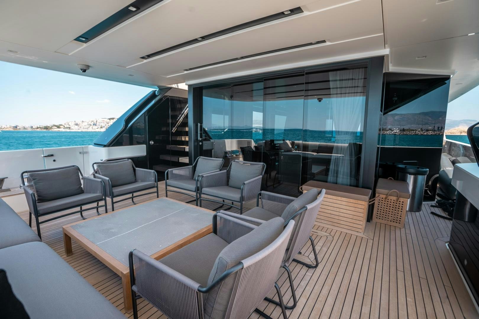 a living room with a large balcony aboard ACE Yacht for Sale