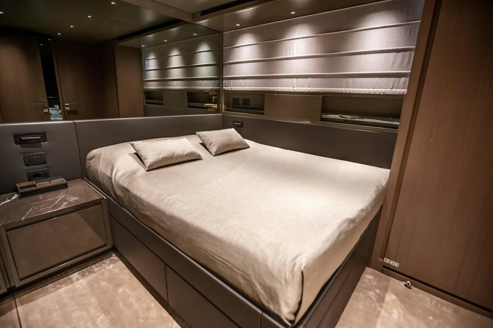 a bed in a room aboard ACE Yacht for Sale