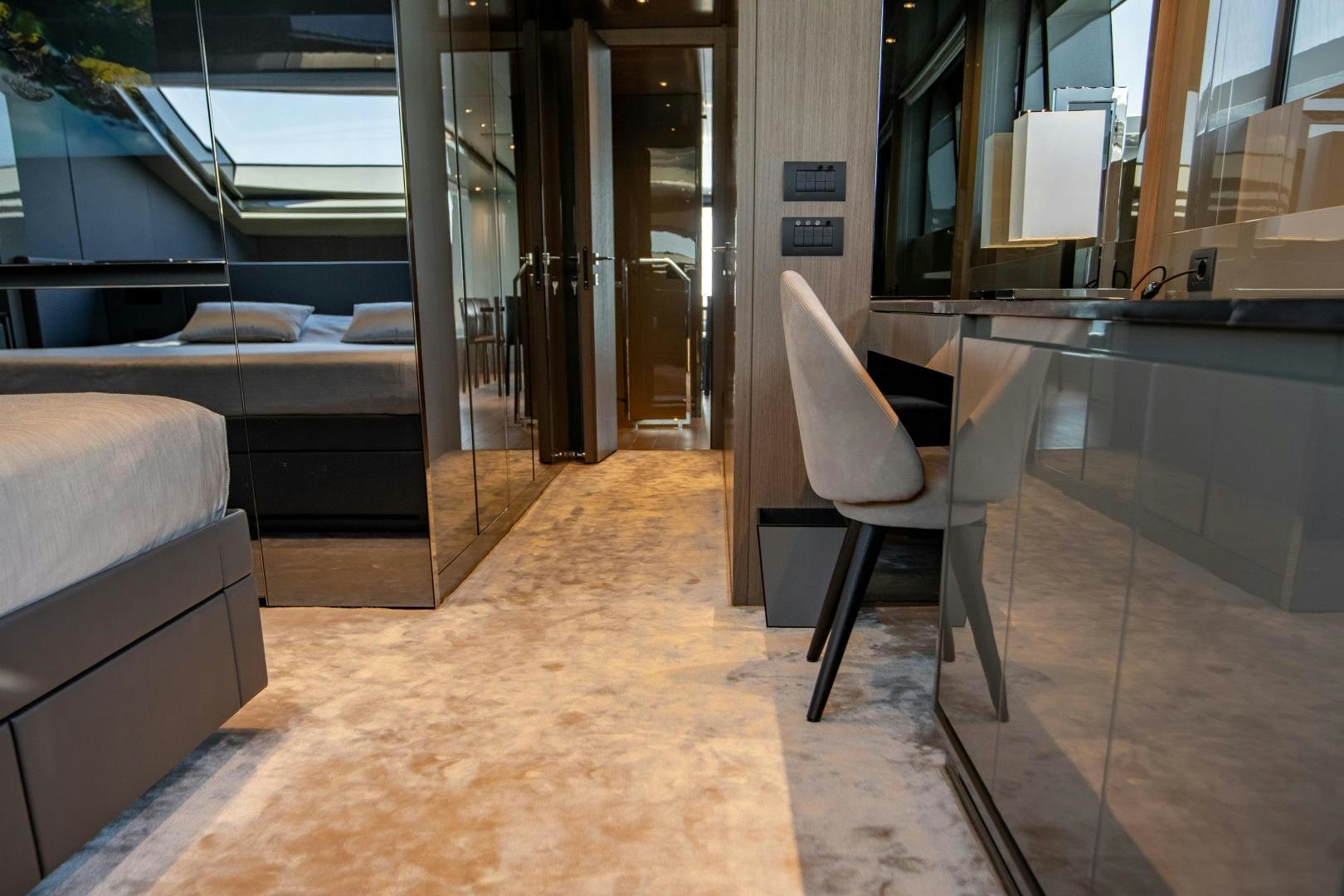a room with a chair and a table aboard ACE Yacht for Sale