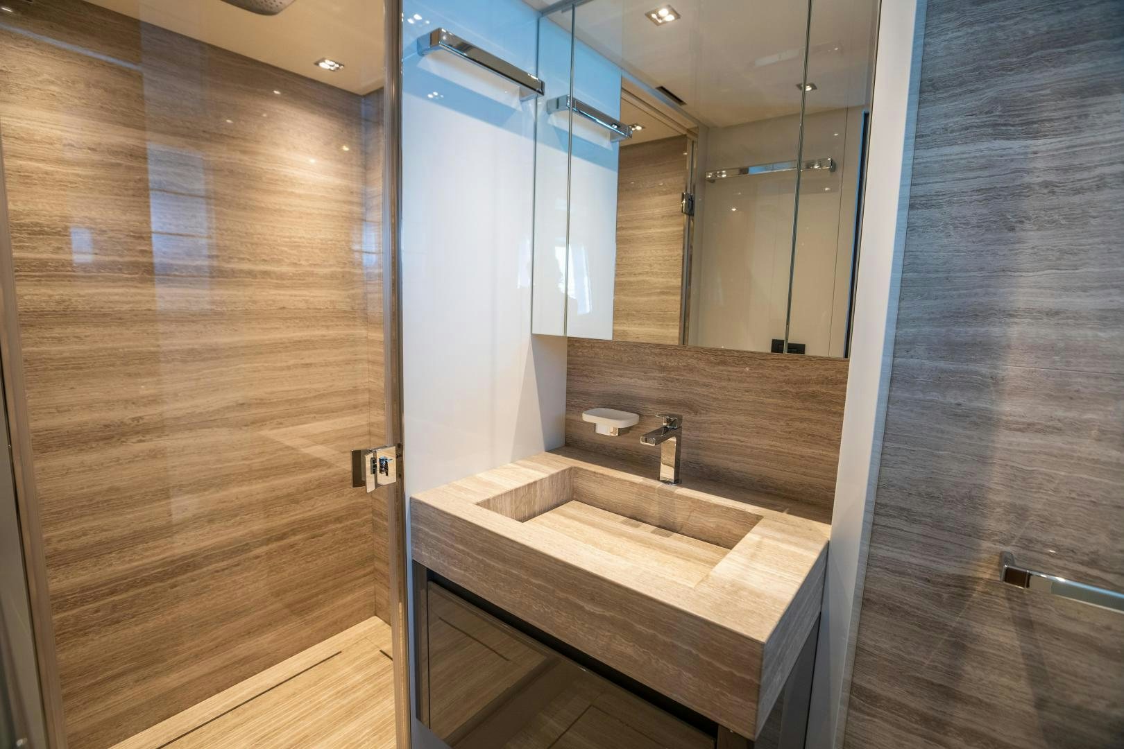 a bathroom with a large mirror aboard ACE Yacht for Sale