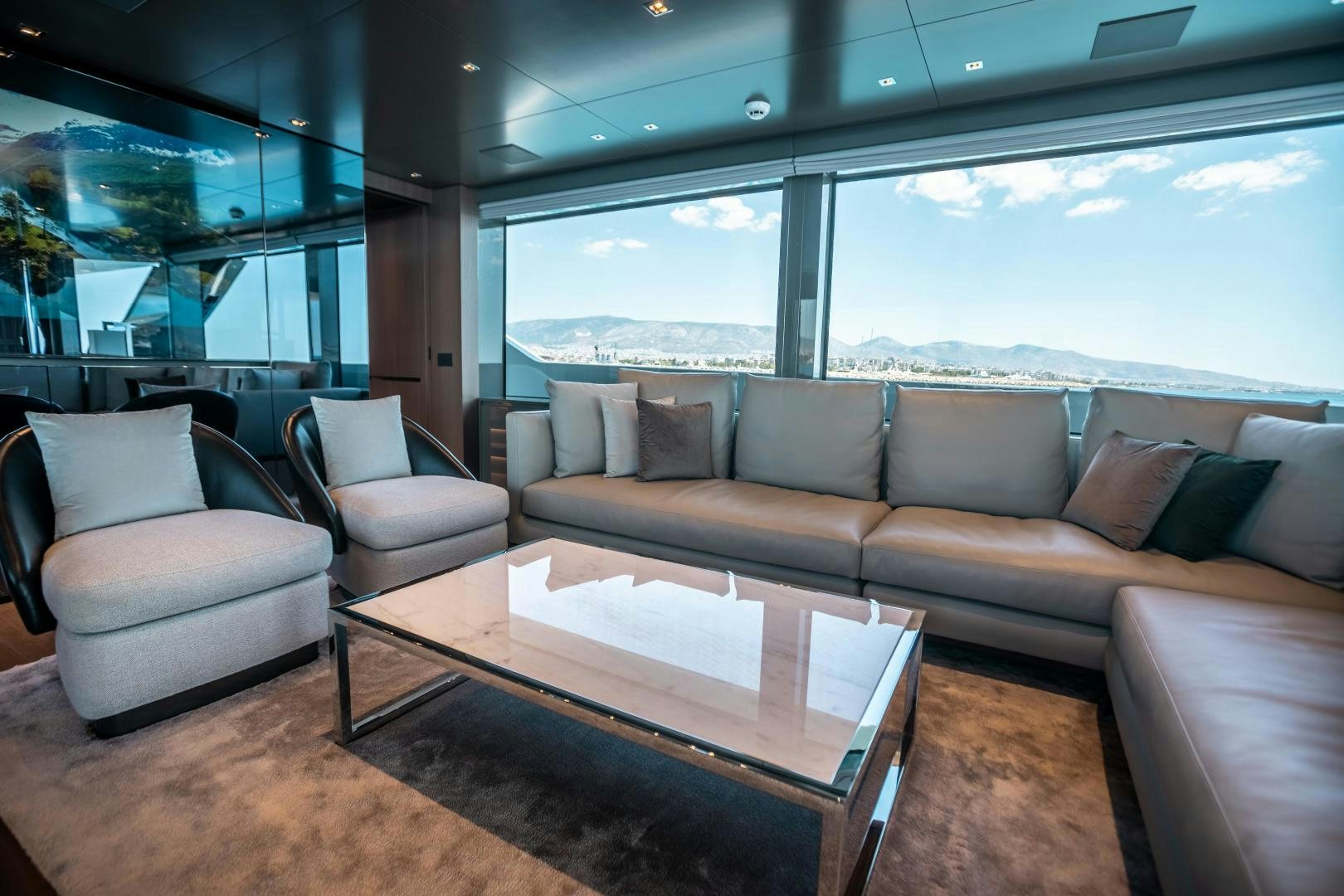a living room with a large window aboard ACE Yacht for Sale