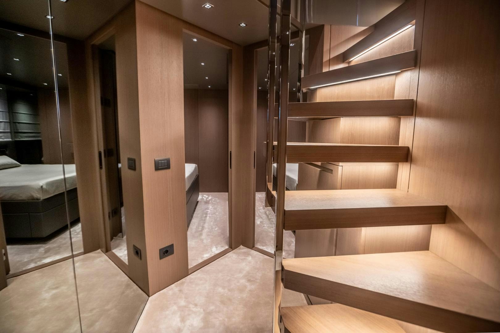 a room with a set of stairs aboard ACE Yacht for Sale