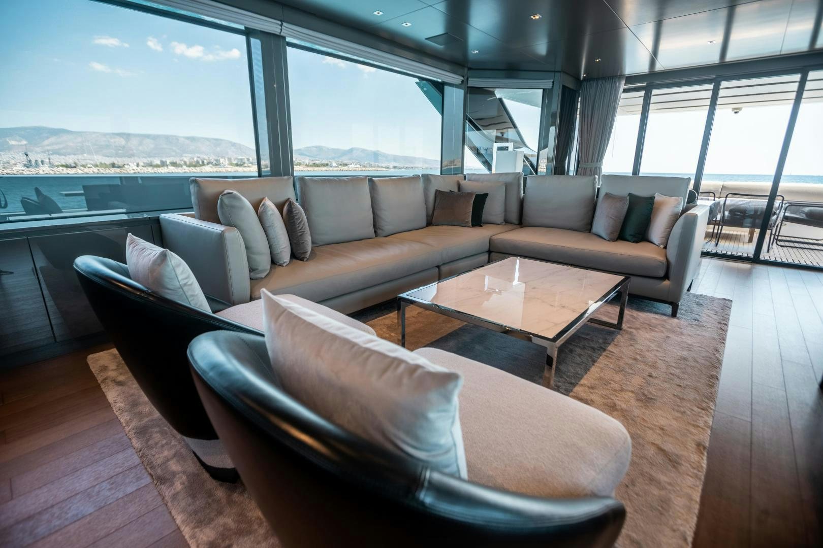 a living room with a large window aboard ACE Yacht for Sale