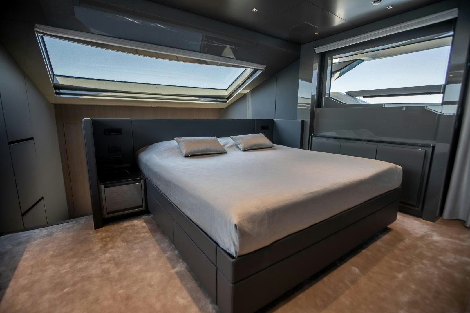 a bed in a room aboard ACE Yacht for Sale