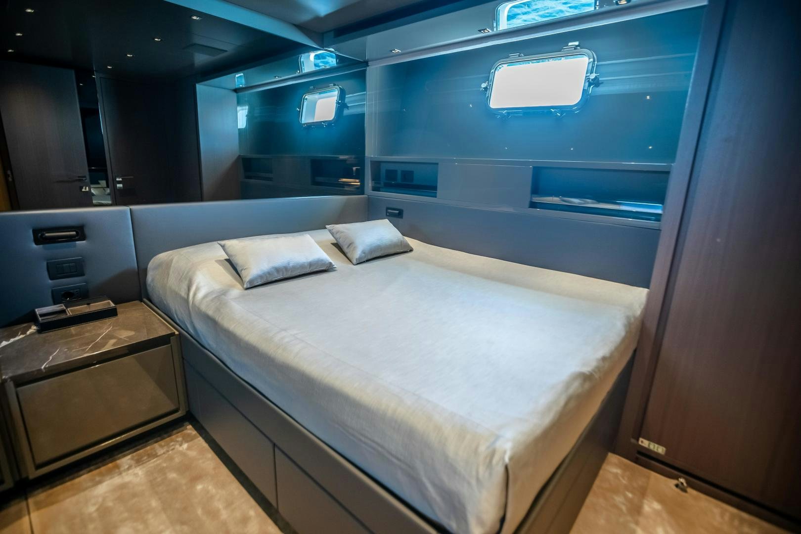 a bed in a room aboard ACE Yacht for Sale