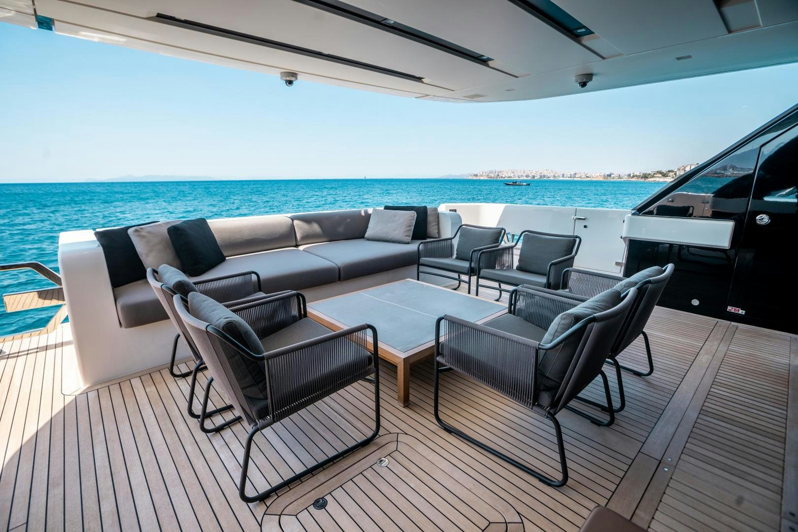 a living room with a couch and a table aboard ACE Yacht for Sale