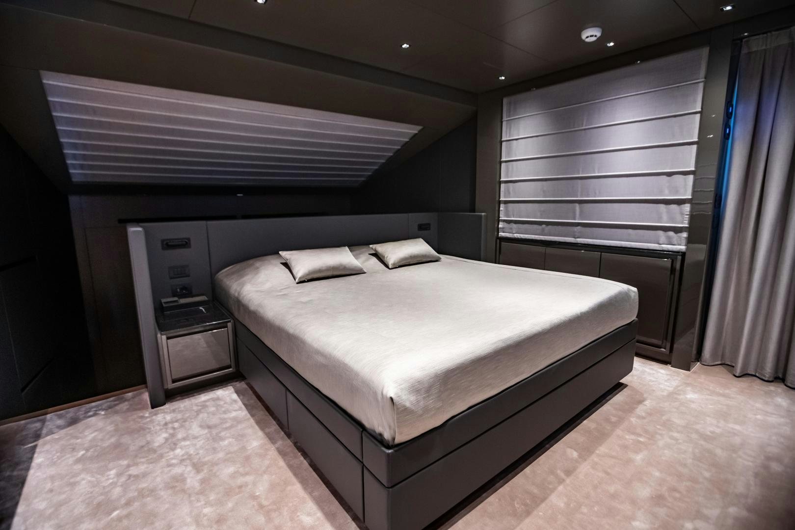 a bed in a room aboard ACE Yacht for Sale