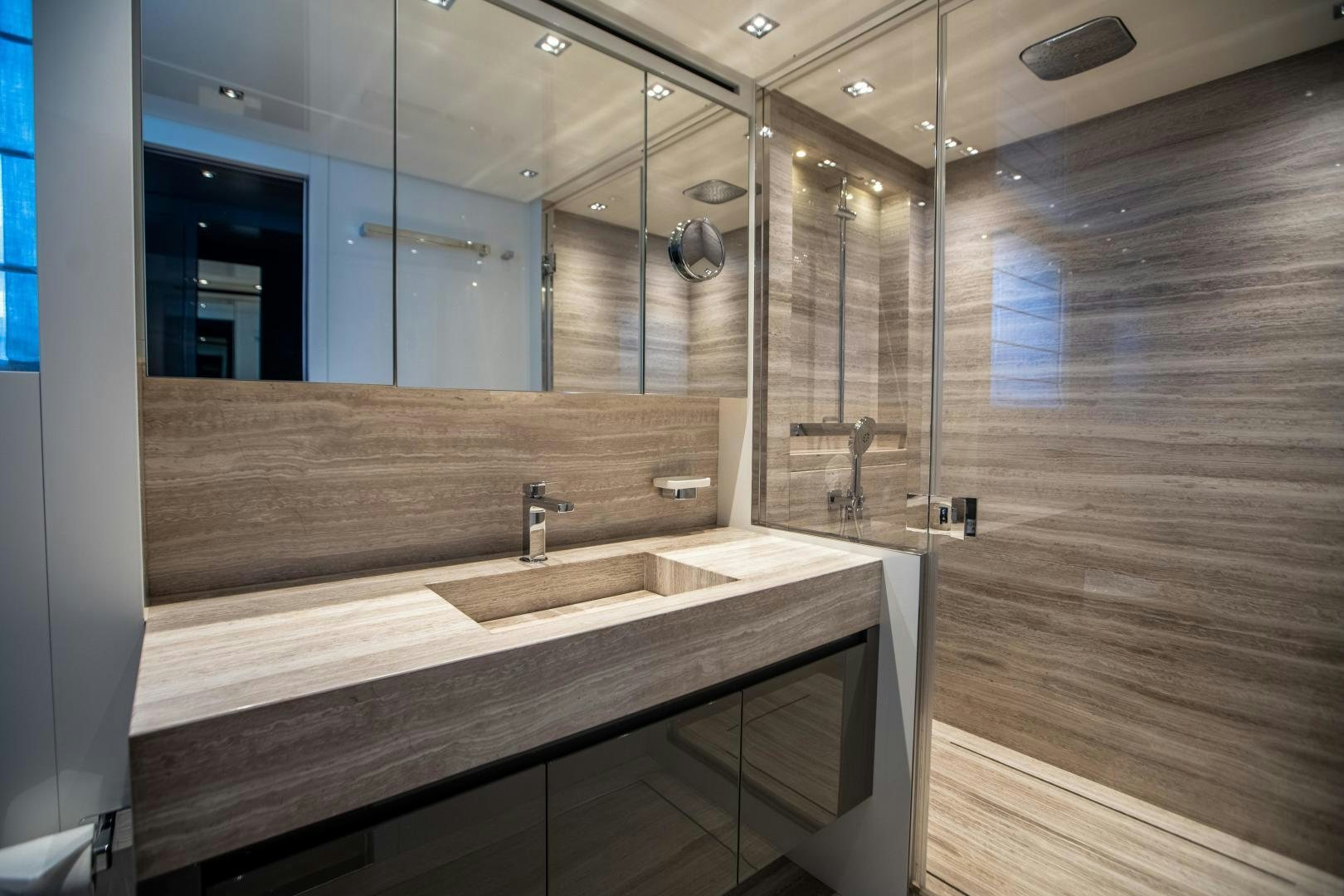 a bathroom with a large mirror aboard ACE Yacht for Sale