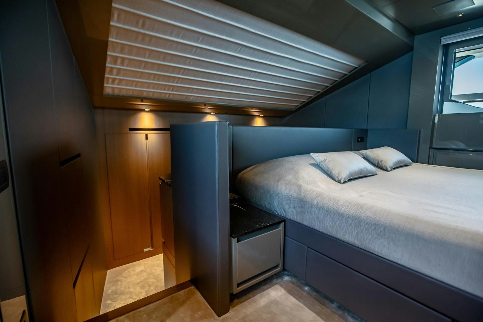 a bed in a room aboard ACE Yacht for Sale