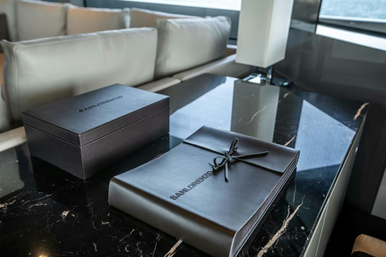 a box and scissors on a table aboard ACE Yacht for Sale