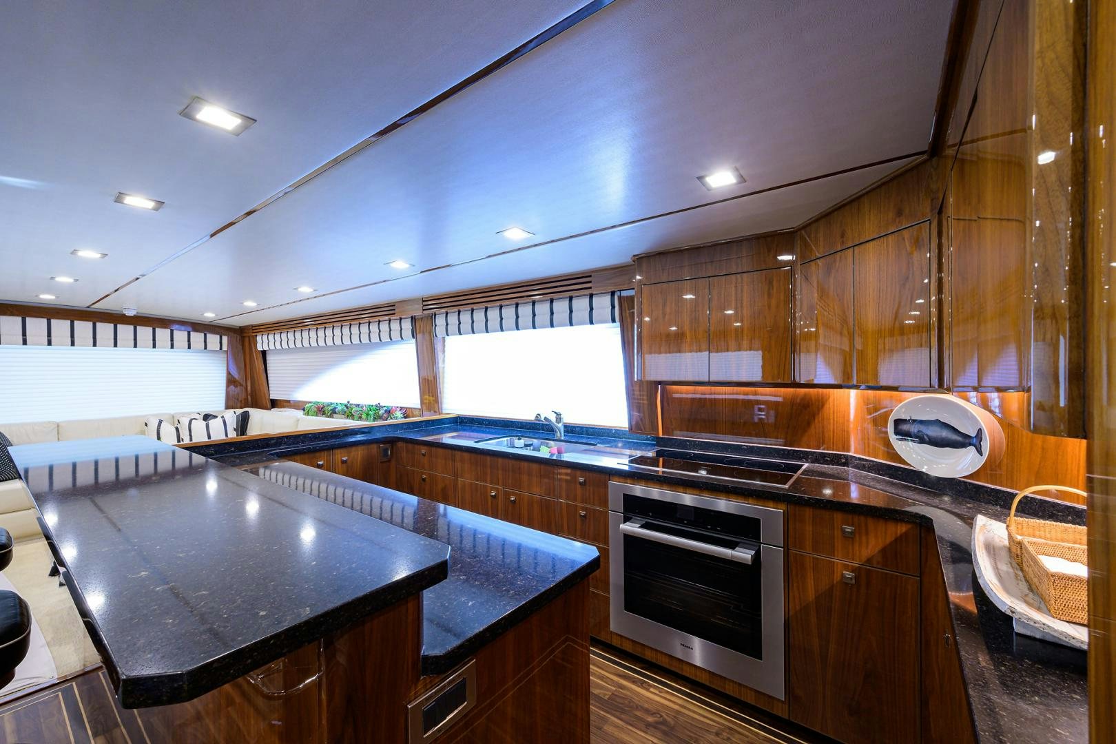 a kitchen with wooden cabinets aboard SET IN MY WAVES Yacht for Sale