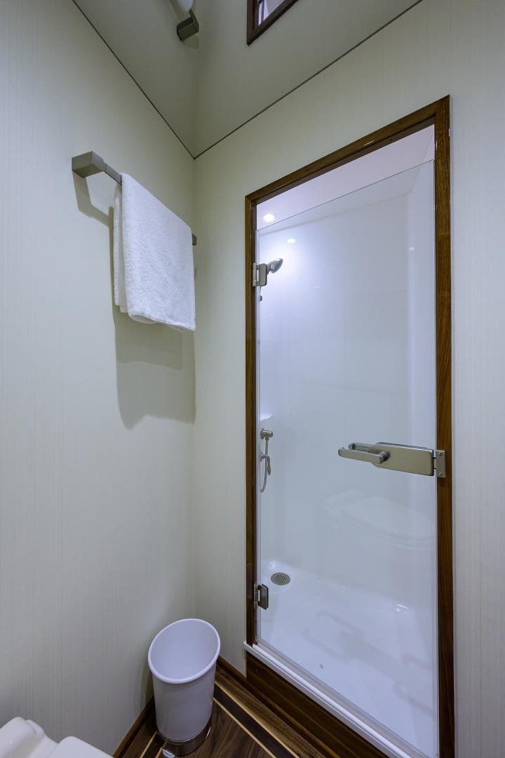 a bathroom with a shower and toilet aboard SET IN MY WAVES Yacht for Sale