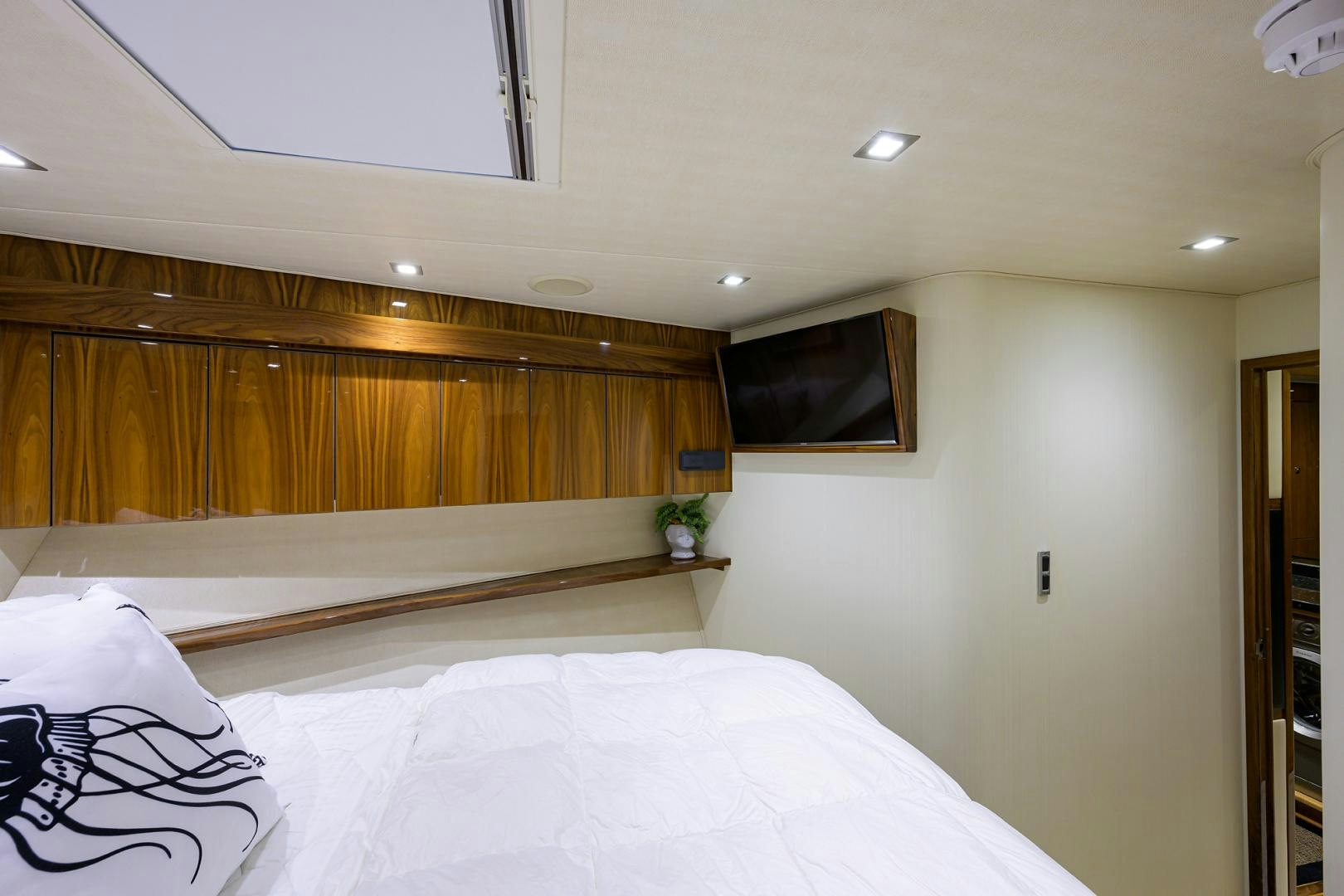 a bed with white sheets aboard SET IN MY WAVES Yacht for Sale