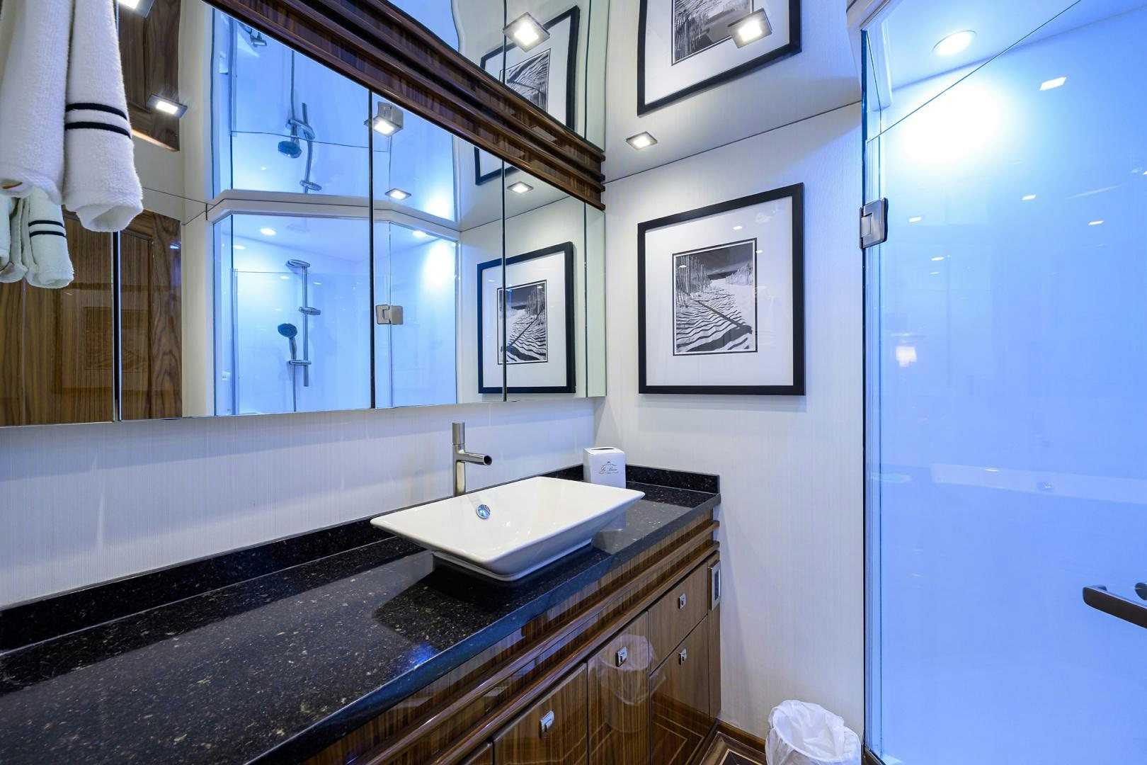 a bathroom with a sink and a mirror aboard SET IN MY WAVES Yacht for Sale