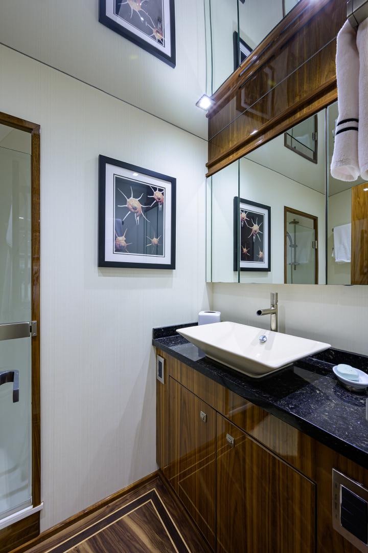 a bathroom with a sink and a mirror aboard SET IN MY WAVES Yacht for Sale