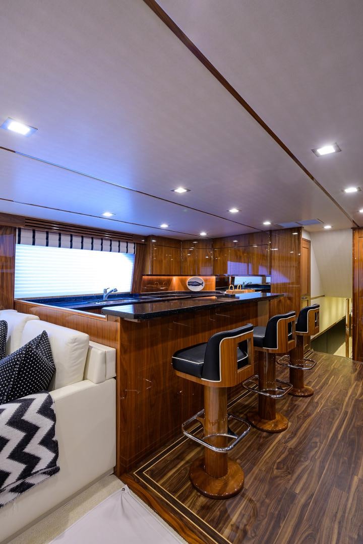 a room with a desk and a bed aboard SET IN MY WAVES Yacht for Sale